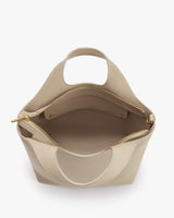 Open handbag with a zipper and interior pocket visible.