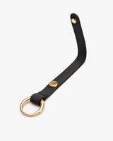 Leather strap with a round metal ring at one end