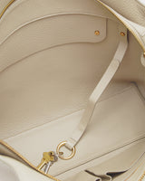 Inside view of a travel bag with a strap holding keys.