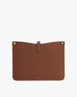 Rectangular textured leather pouch with a tab closure at the top.