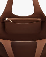 Open tote bag with zippered pouch inside and two handles.