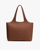 Tote bag with two handles on a plain background.