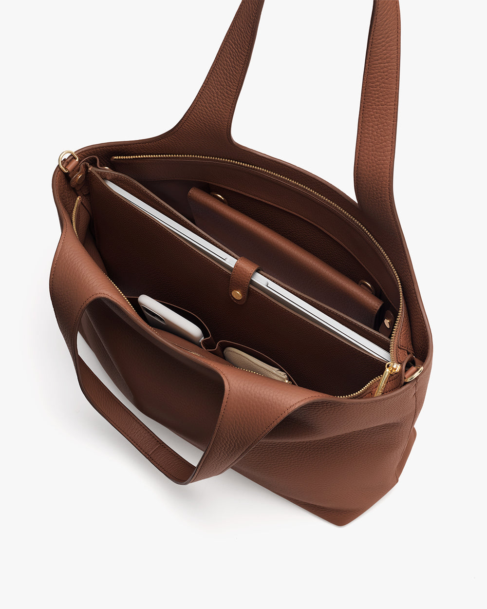 Open tote bag with laptop and other items inside.