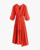 Long dress with V-neck and gathered waist, featuring three-quarter sleeves.