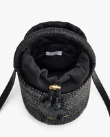 Woven bag with drawstring closure and shoulder strap shown from top view.