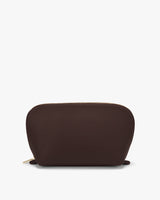 Pouch with zipper on top against plain background.