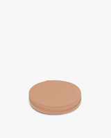 Round zippered pouch on a plain background.