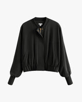 Bomber jacket with ribbed cuffs and snap buttons.