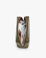 Top view of a backpack with zippers open showing contents inside.