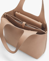 Open handbag with visible interior compartments.