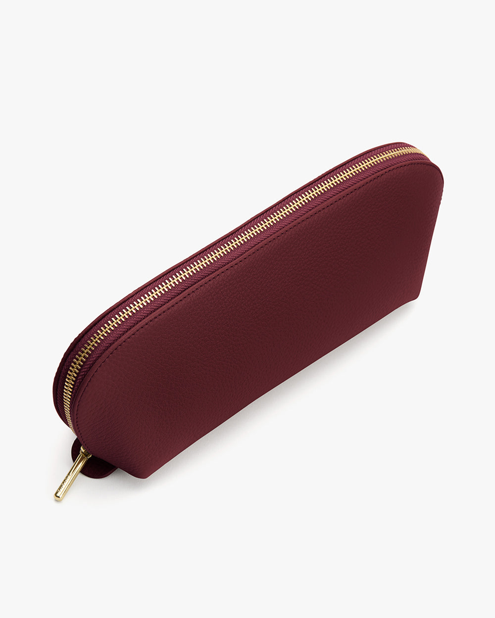 Beauty Case A zippered pouch with a textured surface.