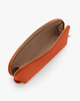 Open clutch bag with a zipper, viewed from above.