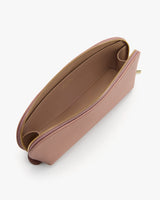 Open zipper pouch on a white surface, showing interior compartments.