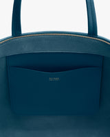 Close-up of a travel bag with visible zipper and pocket.