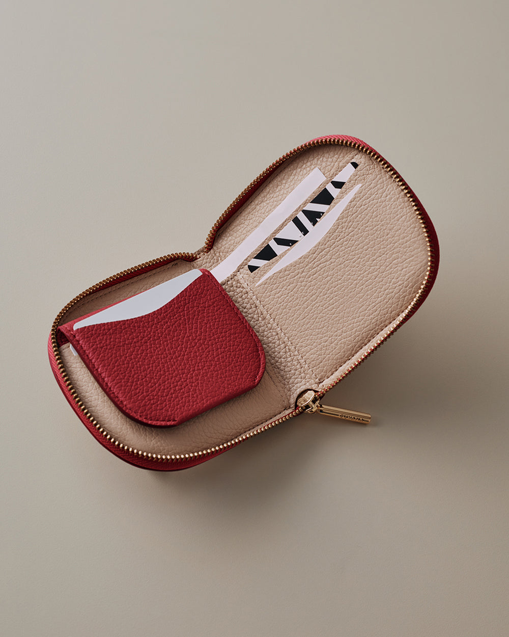 Duo Small Zip Wallet Small open wallet with card slots and coin compartments.