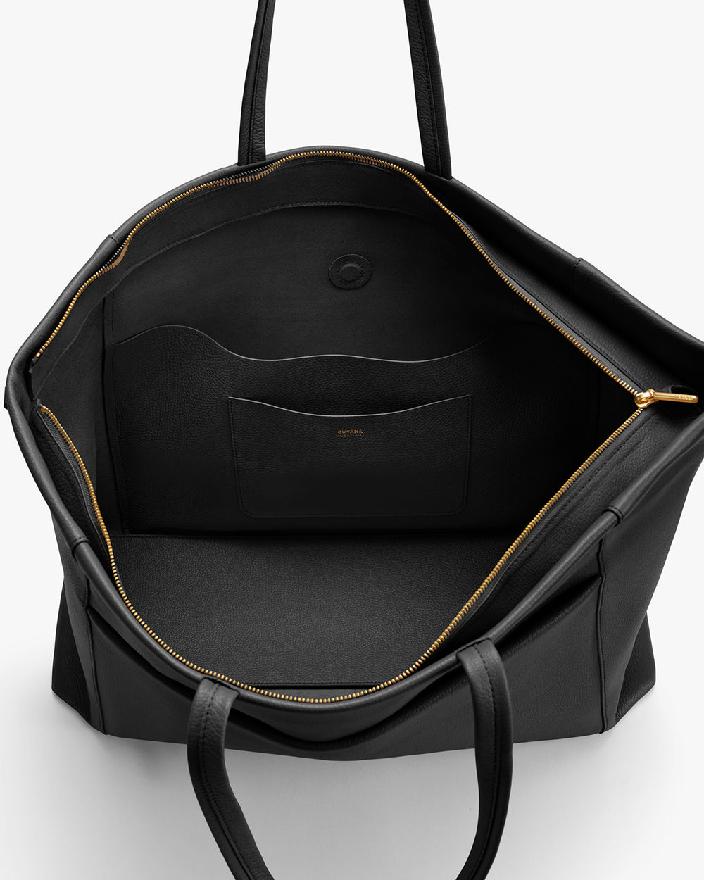 Open travel bag showing inner pocket and zippers.