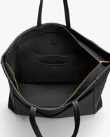 Open travel bag showing inner pocket and zippers.