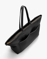 Tote bag with two shoulder straps and zipper closure viewed from a high angle.