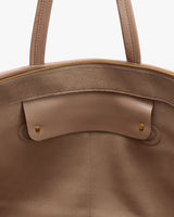 Open travel bag with zipper and handle visible