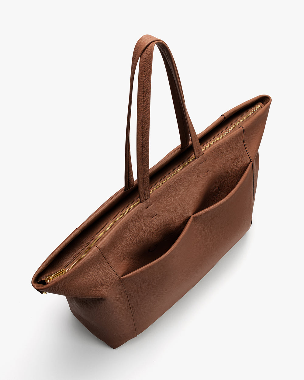 Tote bag with multiple pockets and long handles on a plain background.