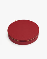Round textured case with zipper closure.