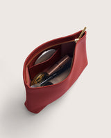 Open makeup bag with cosmetics inside