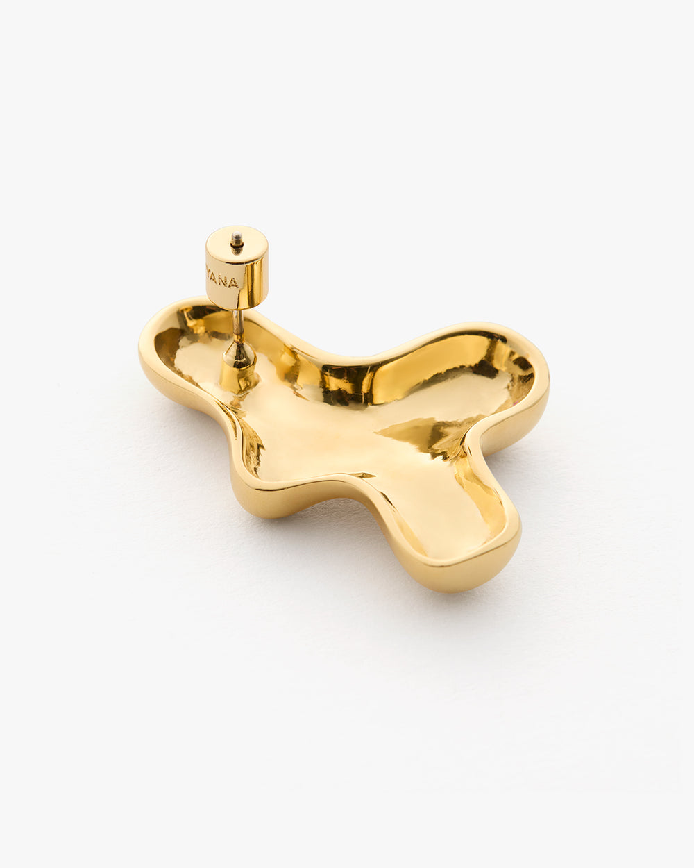 Shiny abstract-shaped jewelry holder with a small cylindrical holder on top.