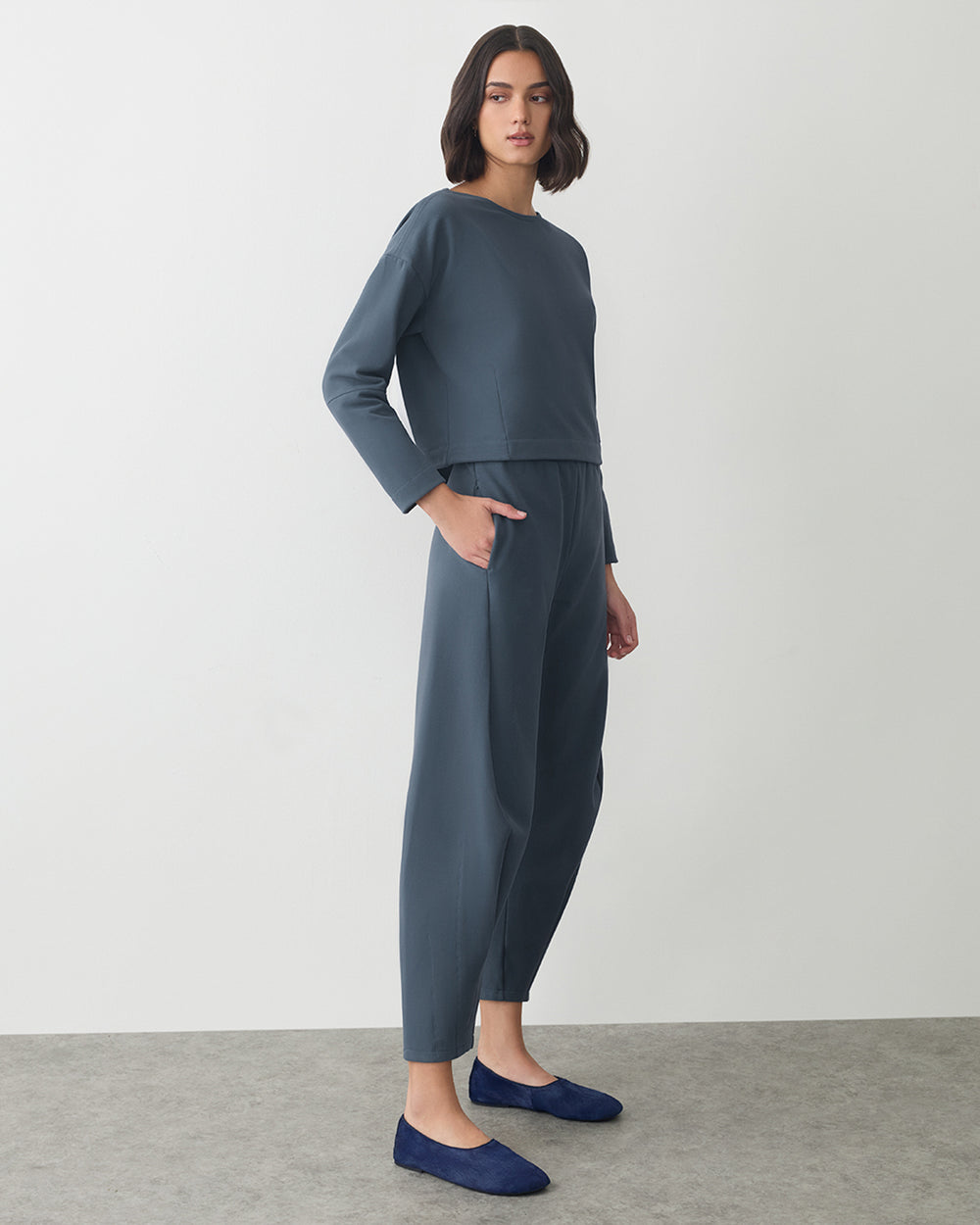 Fleece Cinched Top Person wearing a matching set with long sleeves and pants, standing on a plain background.