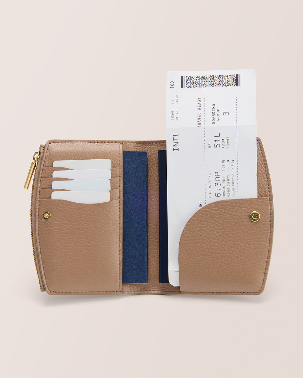 Passport Wallet Open wallet with cards and boarding pass visible.