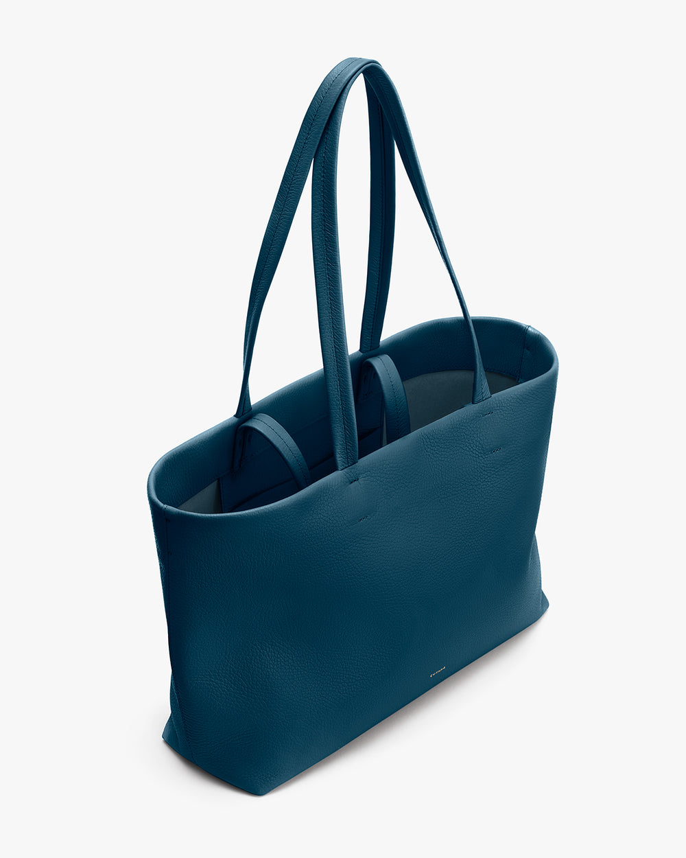 A plain open tote bag with four handles against a plain backdrop.