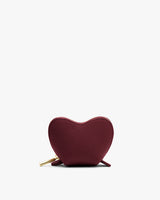 Heart-shaped textured zipper pouch with a zip pull.