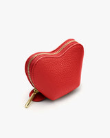 Heart-shaped textured leather coin purse with zipper.