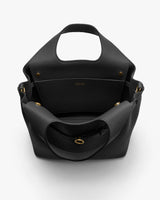 Open handbag with visible interior, handles, and gold-tone accents.
