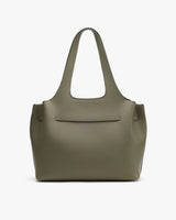 Tote bag with short straps and a front pocket.