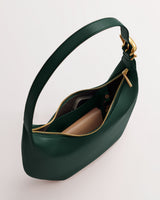 Handbag with open zipper displaying contents inside.
