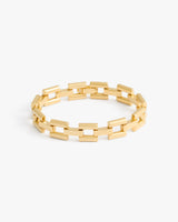 Chain link bracelet with rectangular links on a plain background.