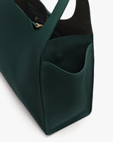 Tote bag with open pocket and visible interior compartment.