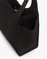 Tote bag with open top and external pockets.