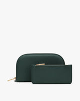 Two zippered pouches, one larger with rounded top, one smaller rectangular, arranged together