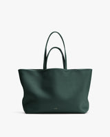 Large tote bag with two handles against plain background.