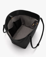 Open top view of a tote bag with interior pockets and straps visible.