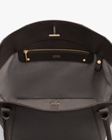 Open handbag with interior zip pocket and two handles.
