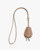 Key holder with a long strap and metal keys inside.