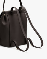 Backpack with long adjustable straps and side hardware detailing.