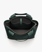 Open travel bag with a visible interior compartment and pockets.