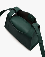 Handbag with a structured design and detachable strap