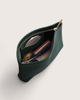Open pouch with makeup items inside.