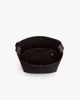 Open tote bag with interior pocket and wide handles.