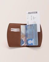 Passport holder with a passport and boarding pass visible.