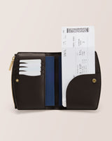 Wallet open displaying cards and a boarding pass.